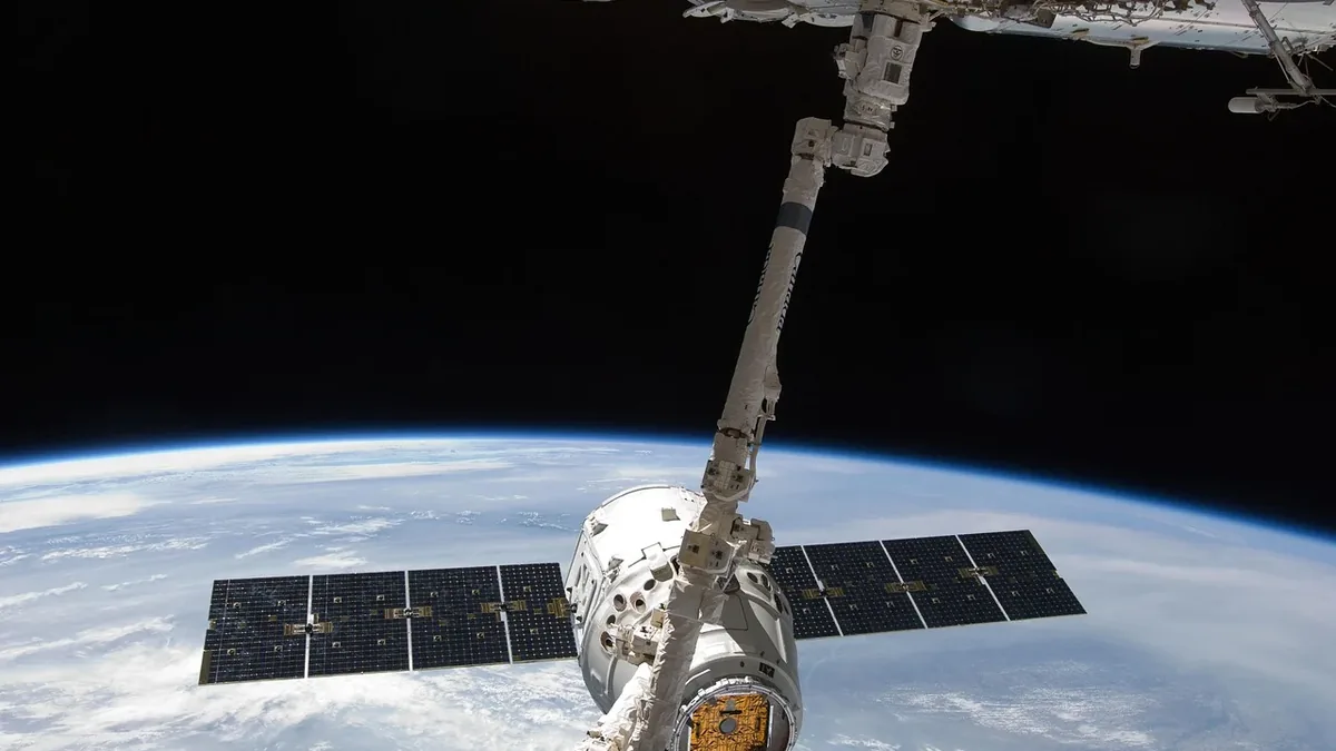 The SpaceX Dragon spacecraft docked to the International Space Station (ISS) in low Earth orbit.